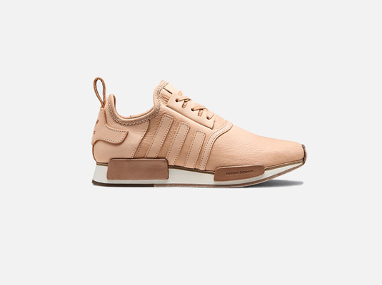 image of a single pair of sport sneaker in beige color, placed in white background